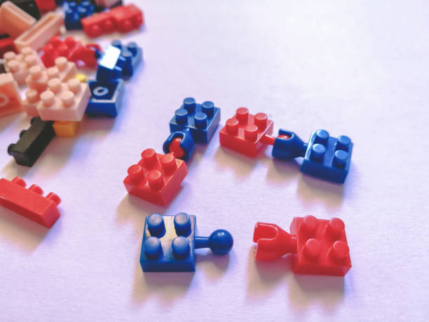 istock red and blue Puzzel plastic connection. construction blocks or brick toy. Children concept of education, development and growth. 946745300