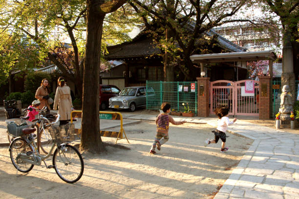 Kids Playing in front of a Kindergarten Gate stock photo