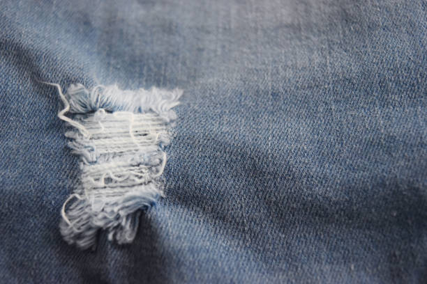 istock Denim surface ,pants with tear and until the fiber jeans. 946748158