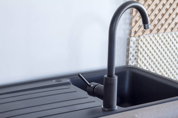istock Modern kitchen and bathroom water faucets in the store 946752446