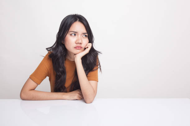 istock Asian girl is getting bore. 946755258