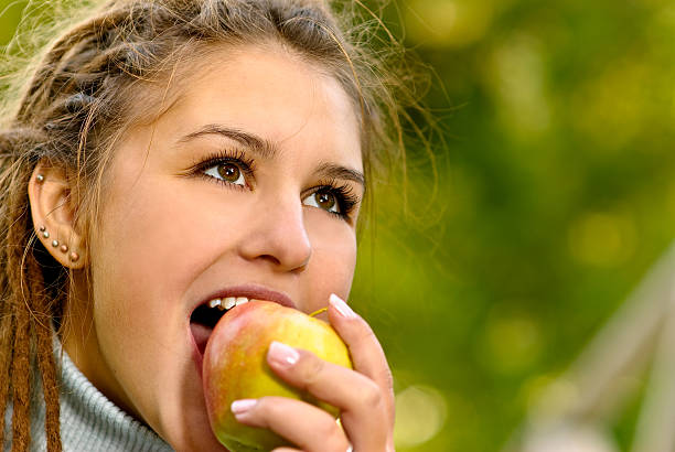 istock Girl with an apple 94676545