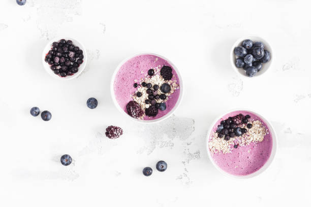 istock Blueberry smoothie, fruits on white background. Flat lay, top view 946766250