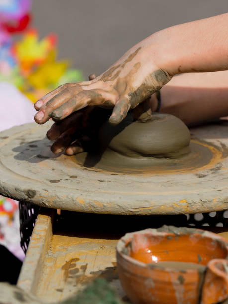istock Senior teacher works clay with young students 946769026