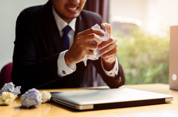 istock Businessman failure project plan deadline serious emotion and depression or deadline at office room with paperwork report on workplace 946769676