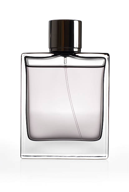 botella de perfume aislado sobre un fondo blanco - perfume sprayer fotografías e imágenes de stock