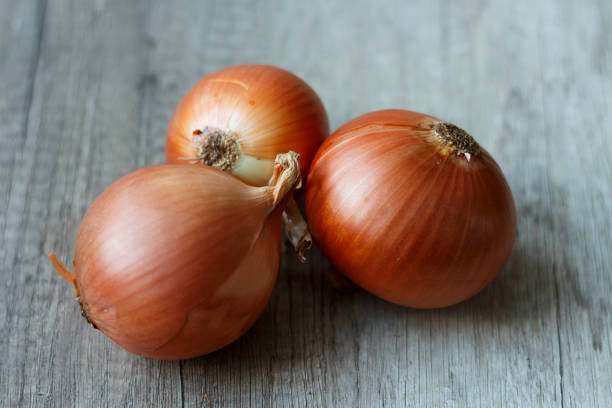istock fresh, full of vitamins onions lay on the table 946790890