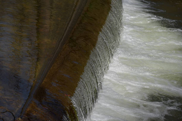 istock Weir on the river, the sun shines. 946792820