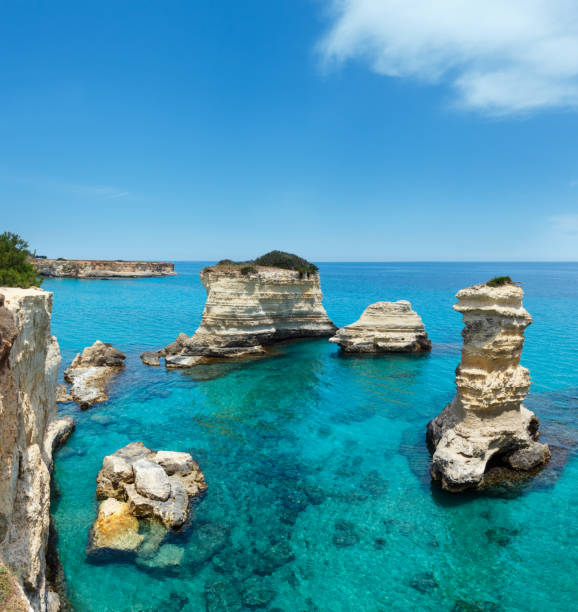 istock Faraglioni at Torre Sant Andrea, Italy 946795516