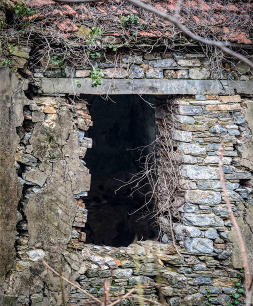 istock Old desroyed window on stone made abandoned house. 946795858