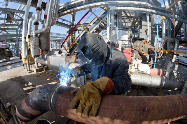 istock Welding works at installation of new pipeline 946803074