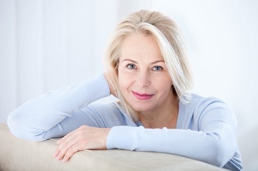 Active Beautiful Middleaged Woman Smiling Friendly And Looking Into The  Camera Woman39s Face Close Up Stock Photo - Download Image Now - iStock