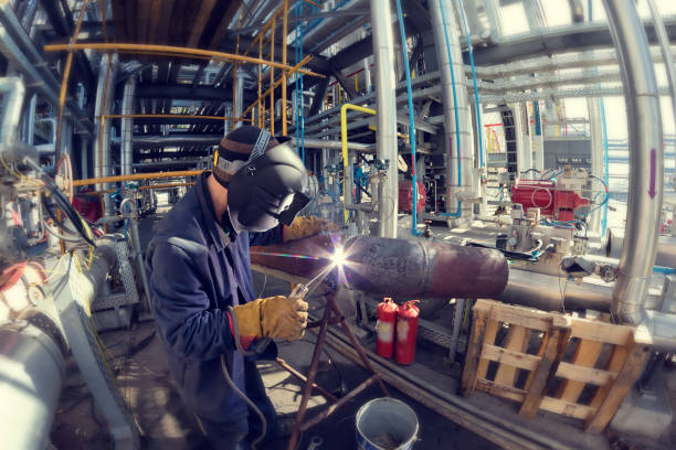 istock Welding works at installation of new pipeline 946803724