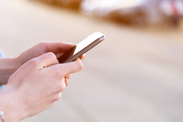istock texting at the street 946803830