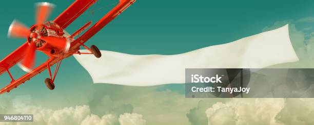 Airplane Flying In The Sky With A Banner Stock Photo - Download Image Now - Airplane, Banner - Sign, Flying