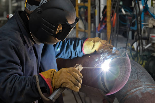 istock Welding works at installation of new pipeline 946810344