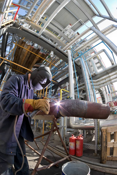 istock Welding works at installation of new pipeline 946810916