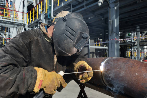 istock Welding works at installation of new pipeline 946815278