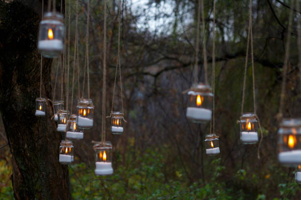 istock Decorated candles hang in the forest 946815510