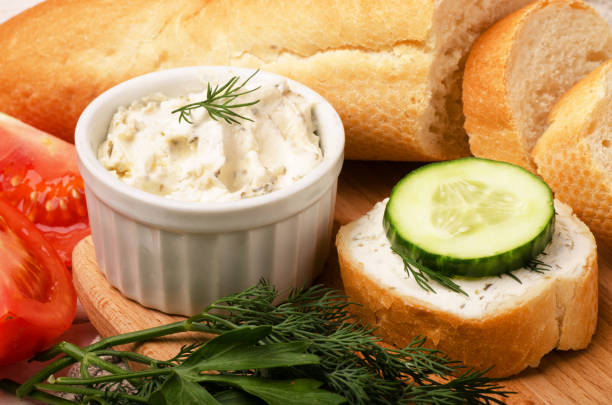 istock Crunchy baguette slices with cream cheese 946817466