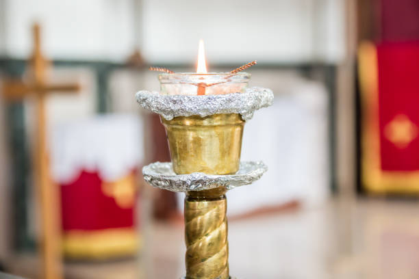 istock Burning candle in brass holder 946824658