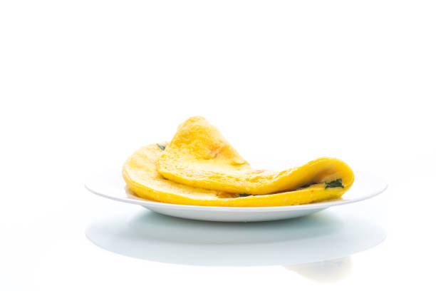 omelette from chicken eggs with green onion isolated on white background