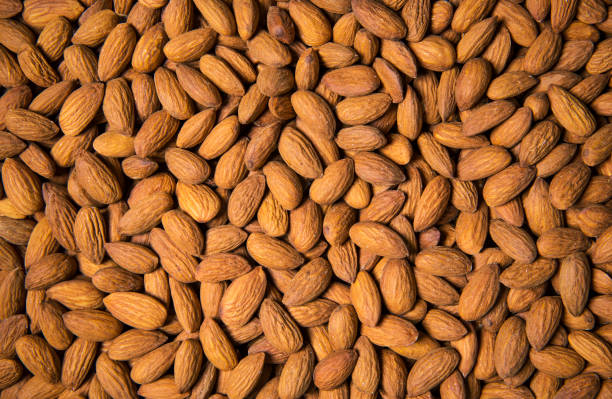 istock Almond seeds as food background 946825308
