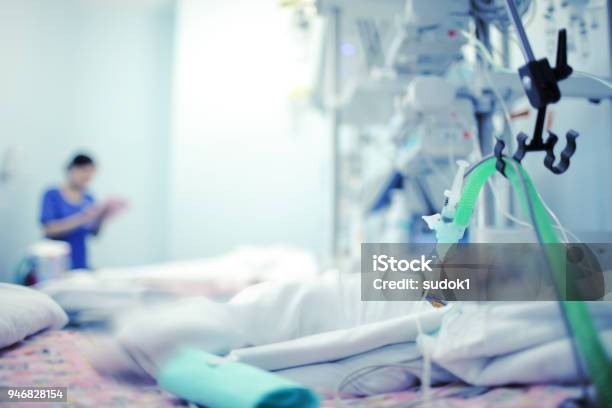 Heavy Breathing Baby With The Help Of The Apparatus And Oxygen In A Hospital Bed In Modern Nicu Stock Photo - Download Image Now