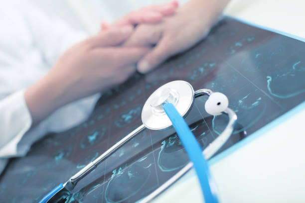 istock Doctor speaking with patient in his office 946828414
