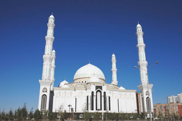 istock White urban mosque in the summer day 946828566
