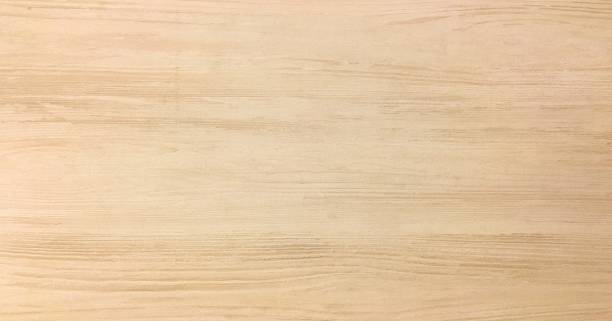 istock wood texture background, light oak wooden planks pattern table top view. 946831198