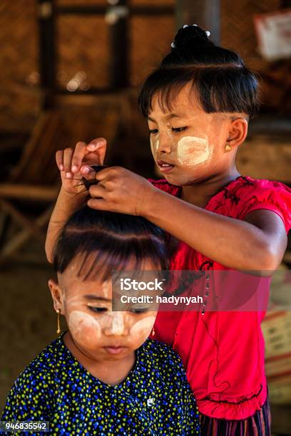 Little Burmese Girl Preparing An Ancient Hairstyle For Her Friend In Village  Near Bagan Myanmar Stock Photo - Download Image Now - iStock