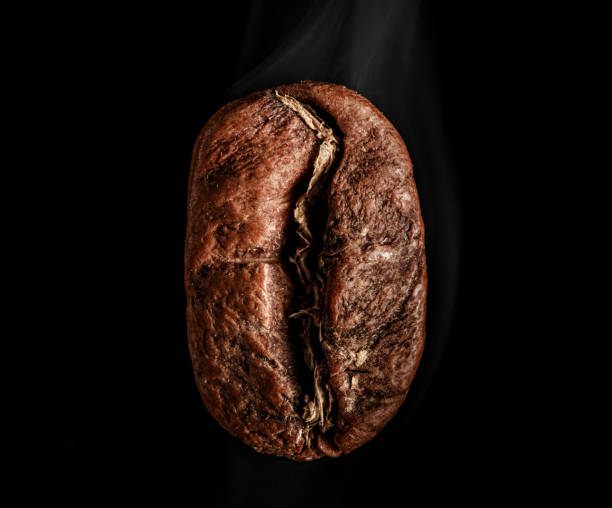 istock Roasted coffee beans isolated on black background 946835754