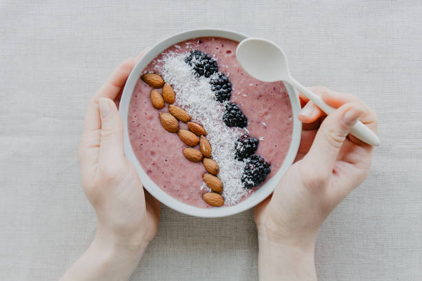 istock Crop person having delicious smoothie bowl 946839276