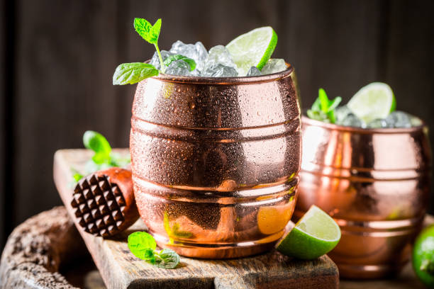 istock Sour cocktail made of rum and herbs on old barrel 946839722
