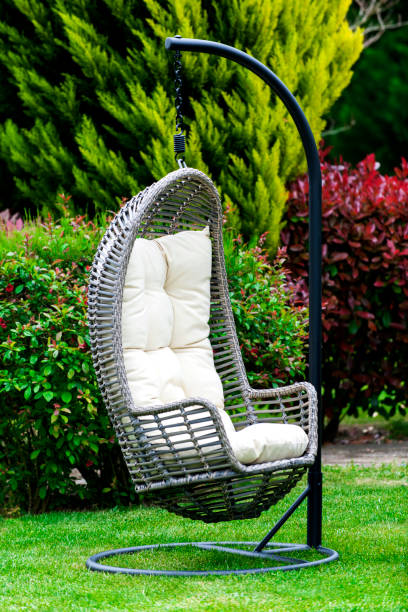 istock Modern hanging chair in garden 946842294
