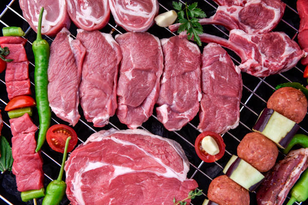 istock Raw mixed red meats on a barbecue 946842322