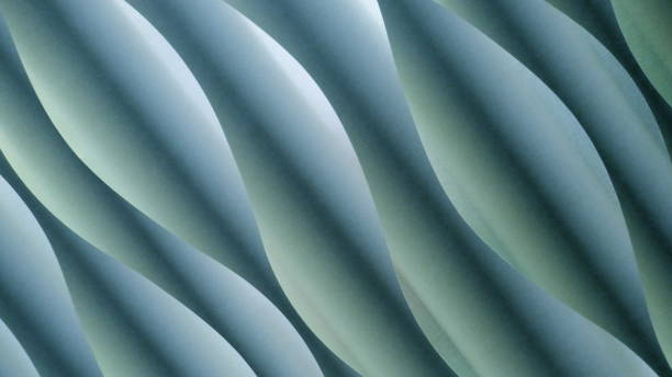 istock Background and texture, turquoise, blue, green. Abstract waves- or spiral pattern with light and shadow effect 946843046