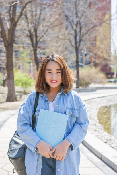 istock Portrait of Asian college student at campus 946847372