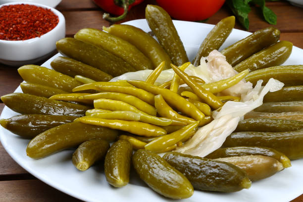 istock Pickled chili peppers and cucumber 946852472