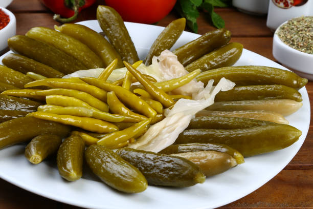istock Pickled chili peppers and cucumber 946852522