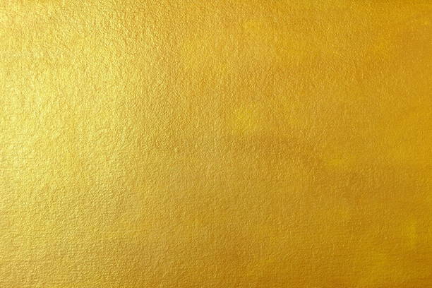 istock Gold Paint on Concrete Wall Texture Background. 946856694