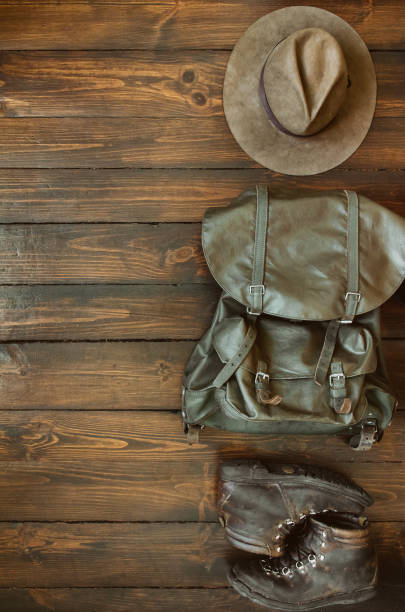 istock Hiking stuff arranged on wooden floor 946856922