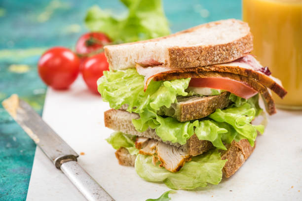 istock Tower healthy sandwich with ham and salad 946860882