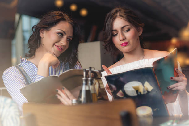 istock girls order food in a restaurant 946861768