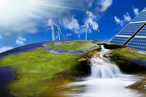 wind turbines and solar panels on the image of the Earth in a context of clean energy