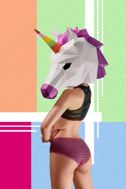 Photo of Backview of Slim model wearing colorful unicorn's head.