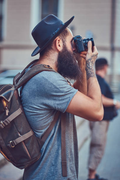 istock A handsome hipster male with a stylish beard and tattoo on his a 946865174