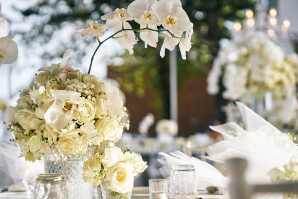istock White roses, flower, floral decoration on thewedding reception dinner table 946870566