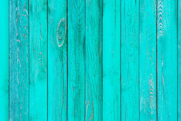 istock Worn dirty wooden board panel painted in turquoise color 946873000